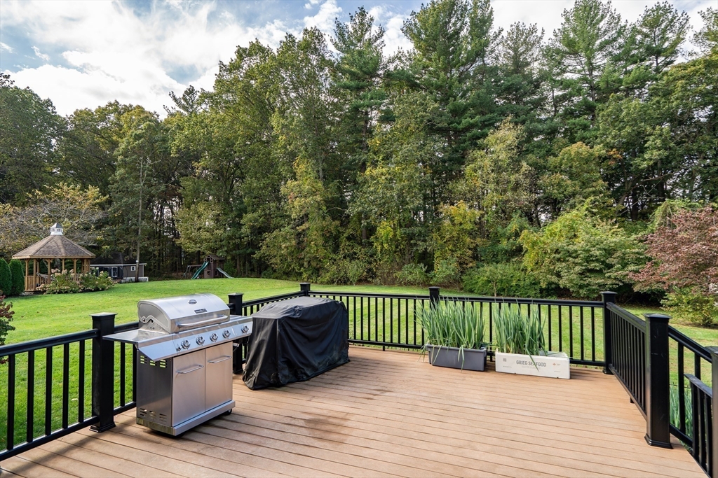 7 Stouffer Circle Andover, MA 01810 - Photo 31 of 37 a view of a deck with wooden floor and barbeque oven