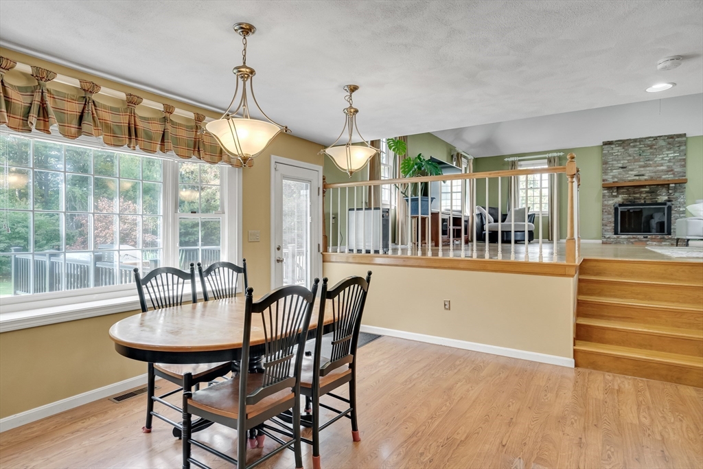 7 Stouffer Circle Andover, MA 01810 - Photo 7 of 37 a dining room with furniture a chandelier and wooden floor