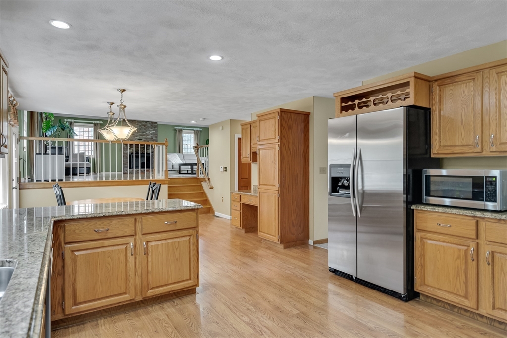 7 Stouffer Circle Andover, MA 01810 - Photo 9 of 37 a kitchen with a refrigerator sink and cabinets
