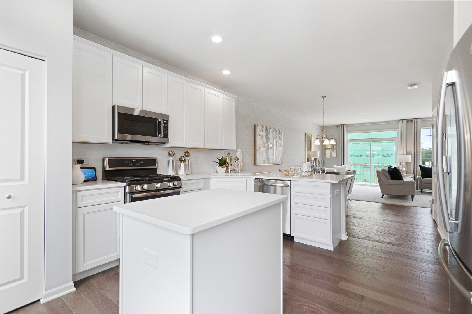 1654 BENTZ Way Batavia, IL 60510 - Photo 12 of 27 a kitchen with white cabinets and stainless steel appliances