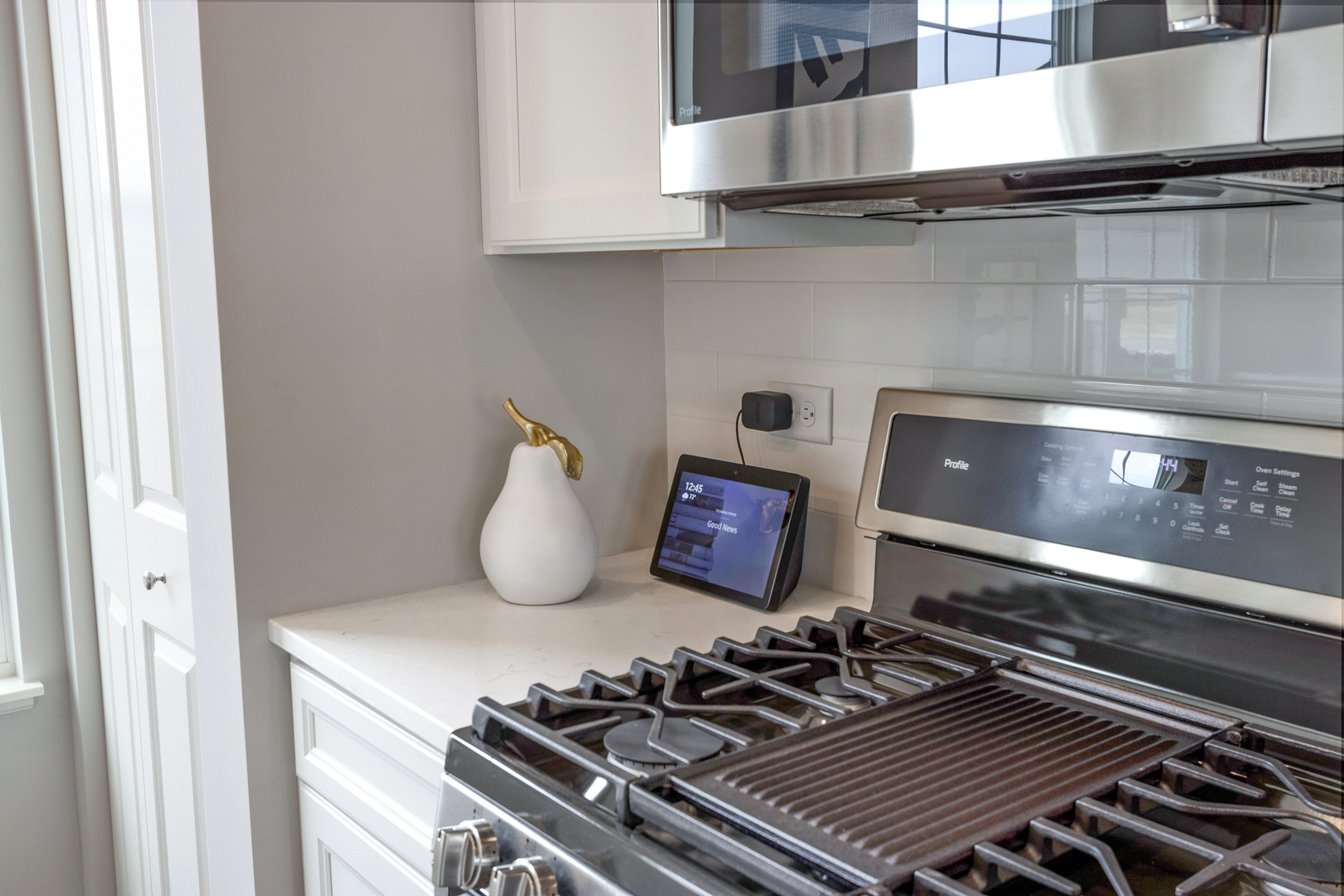 1654 BENTZ Way Batavia, IL 60510 - Photo 13 of 27 a close view of a stove a microwave and cabinets
