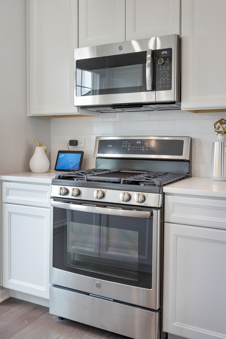 1654 BENTZ Way Batavia, IL 60510 - Photo 14 of 27 a stove top oven sitting inside of a kitchen