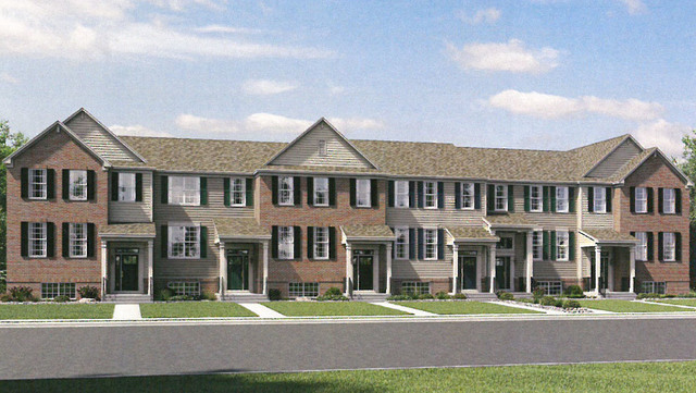 1654 BENTZ Way Batavia, IL 60510 - Photo 2 of 27 a front view of a residential apartment building with a yard