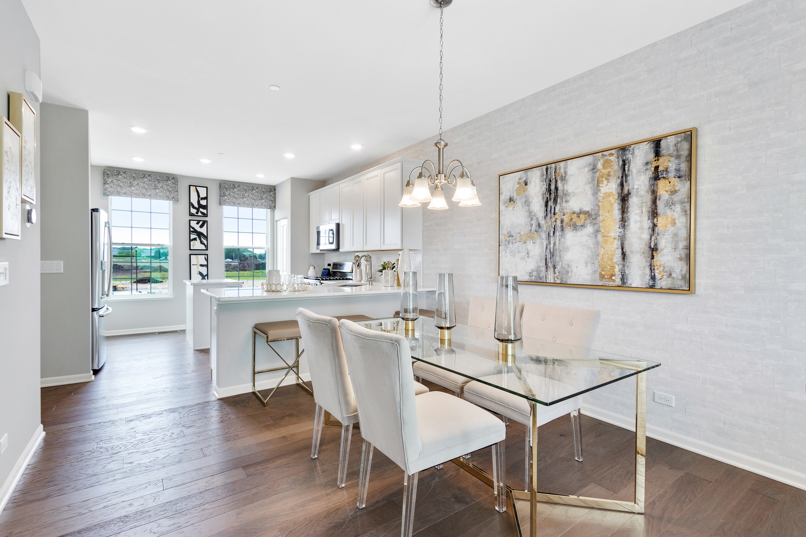 1654 BENTZ Way Batavia, IL 60510 - Photo 10 of 27 a view of a dining room and livingroom with furniture wooden floor a chandelier