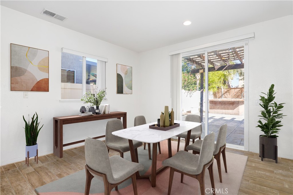 3437 Nature Trail Court Perris, CA 92571 - Photo 17 of 49 a view of a dining room with furniture window and wooden floor