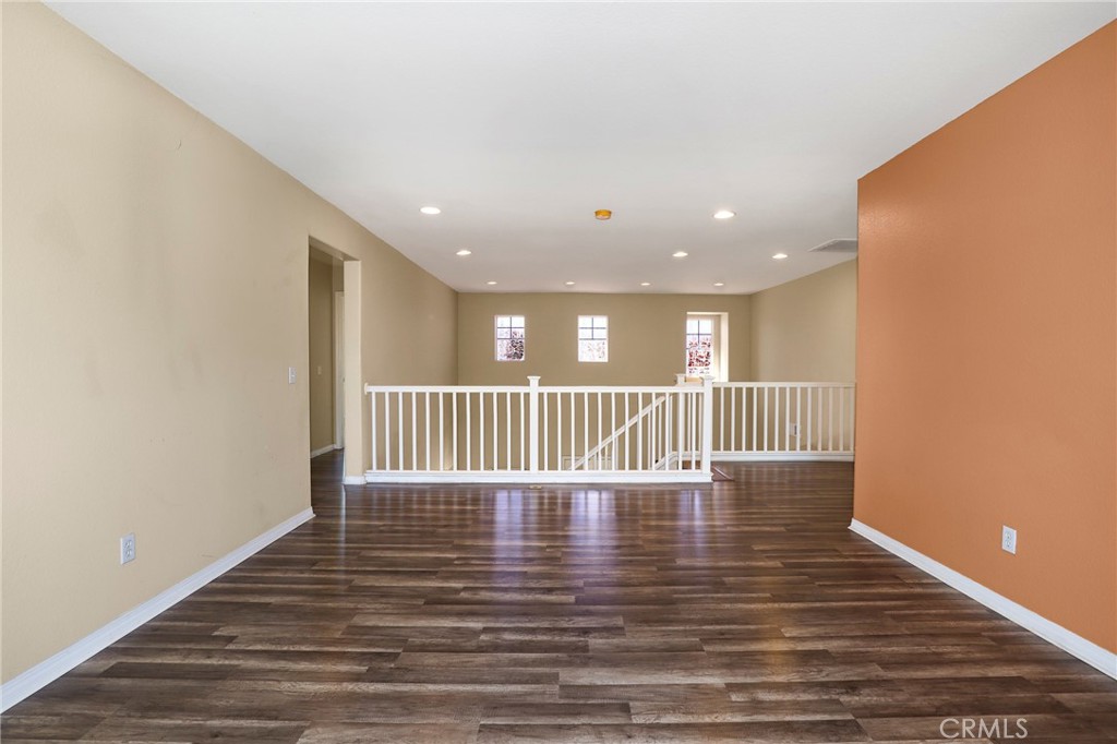 3437 Nature Trail Court Perris, CA 92571 - Photo 27 of 49 a view of an empty room with wooden floor