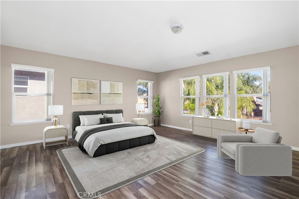 3437 Nature Trail Court Perris, CA 92571 - Photo 31 of 49 a bedroom with a large bed couch and a large window