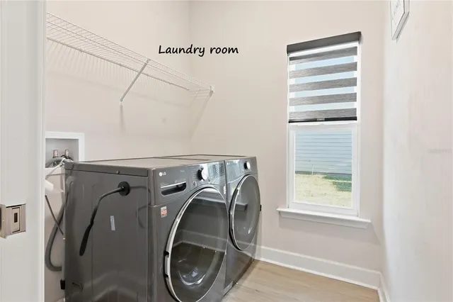 a view of kitchen with white cabinets