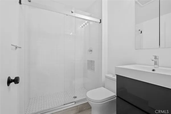 a bathroom with a sink toilet and vanity