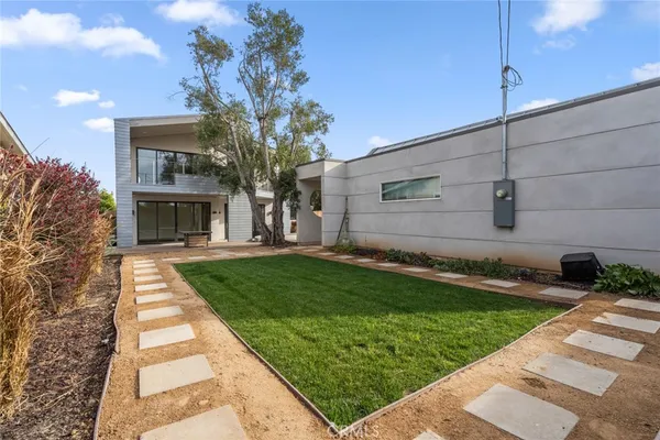 a backyard of a house with lots of green space
