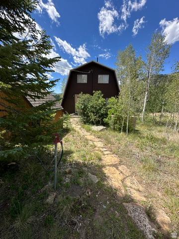 1085 West Elk Road Helper, UT 84526 - Photo 33 of 40 Gambrel-style residence featuring a dark brown exterior and a gable roof