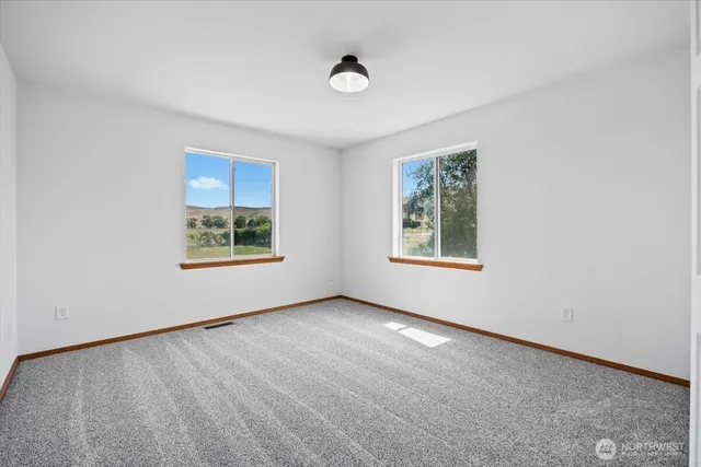 an empty room with windows