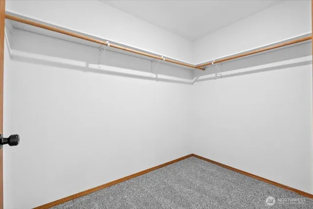 a view of a room with shelf on the wall