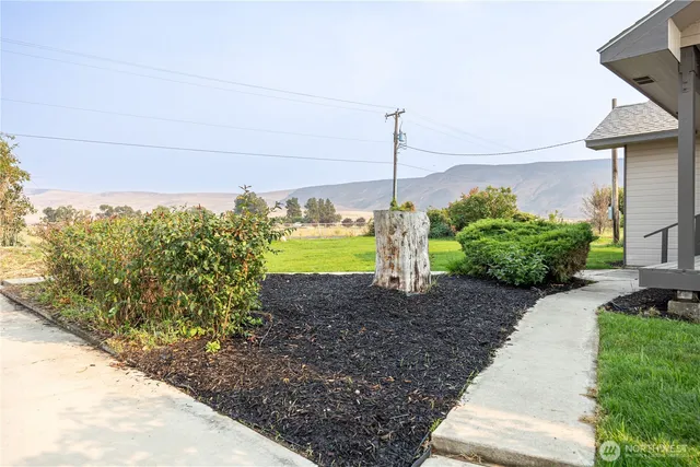 a sign board with a small yard