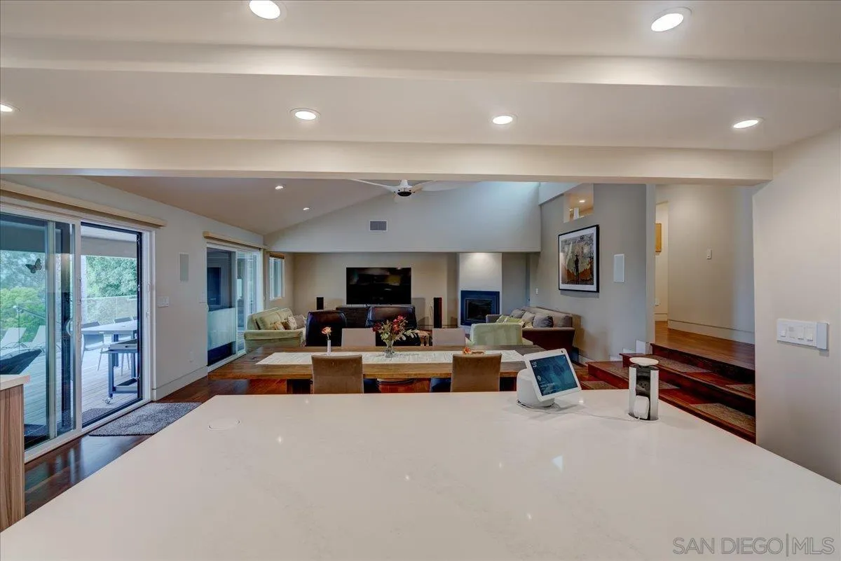 16117 Martincoit Road Poway, CA 92064 - Photo 11 of 50 a large living room with furniture a flat screen tv and a large window
