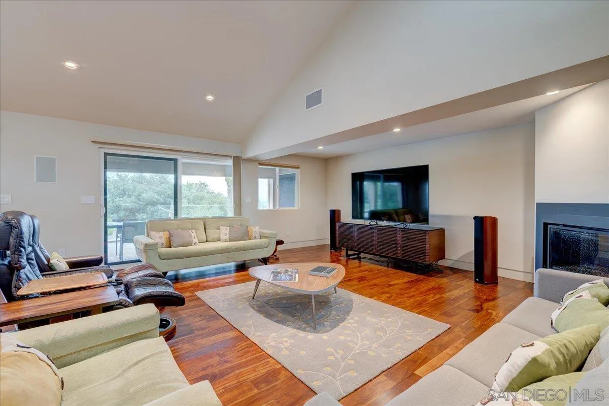16117 Martincoit Road Poway, CA 92064 - Photo 13 of 50 a living room with furniture and a flat screen tv