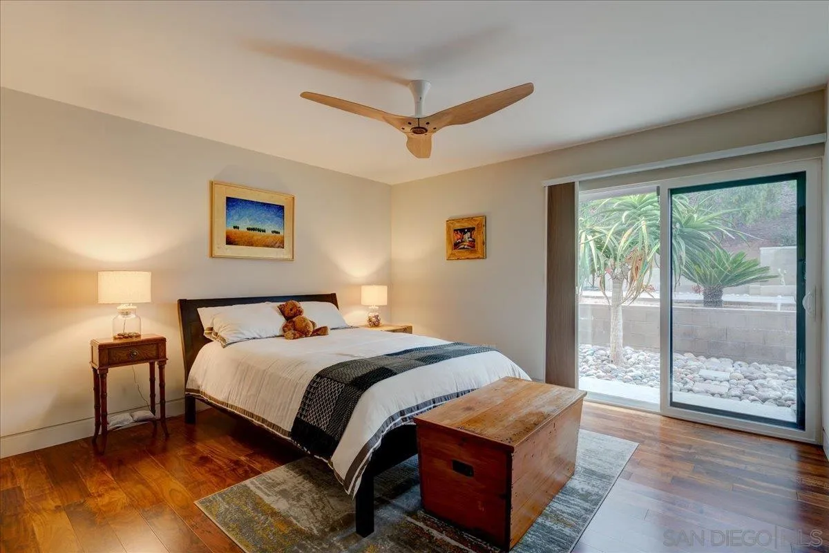 16117 Martincoit Road Poway, CA 92064 - Photo 19 of 50 a bedroom with a bed and wooden floor