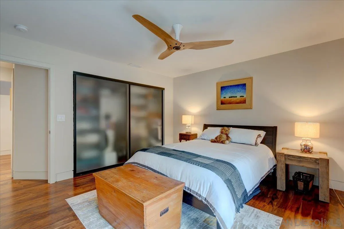 16117 Martincoit Road Poway, CA 92064 - Photo 20 of 50 a bedroom with a bed and a painting on the wall