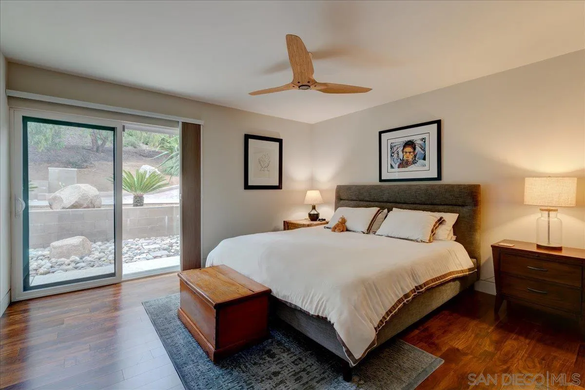 16117 Martincoit Road Poway, CA 92064 - Photo 21 of 50 a bedroom with a bed and wooden floor