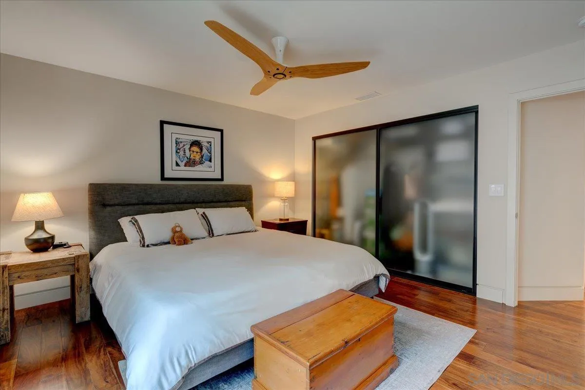 16117 Martincoit Road Poway, CA 92064 - Photo 22 of 50 a bedroom with a bed and a large mirror