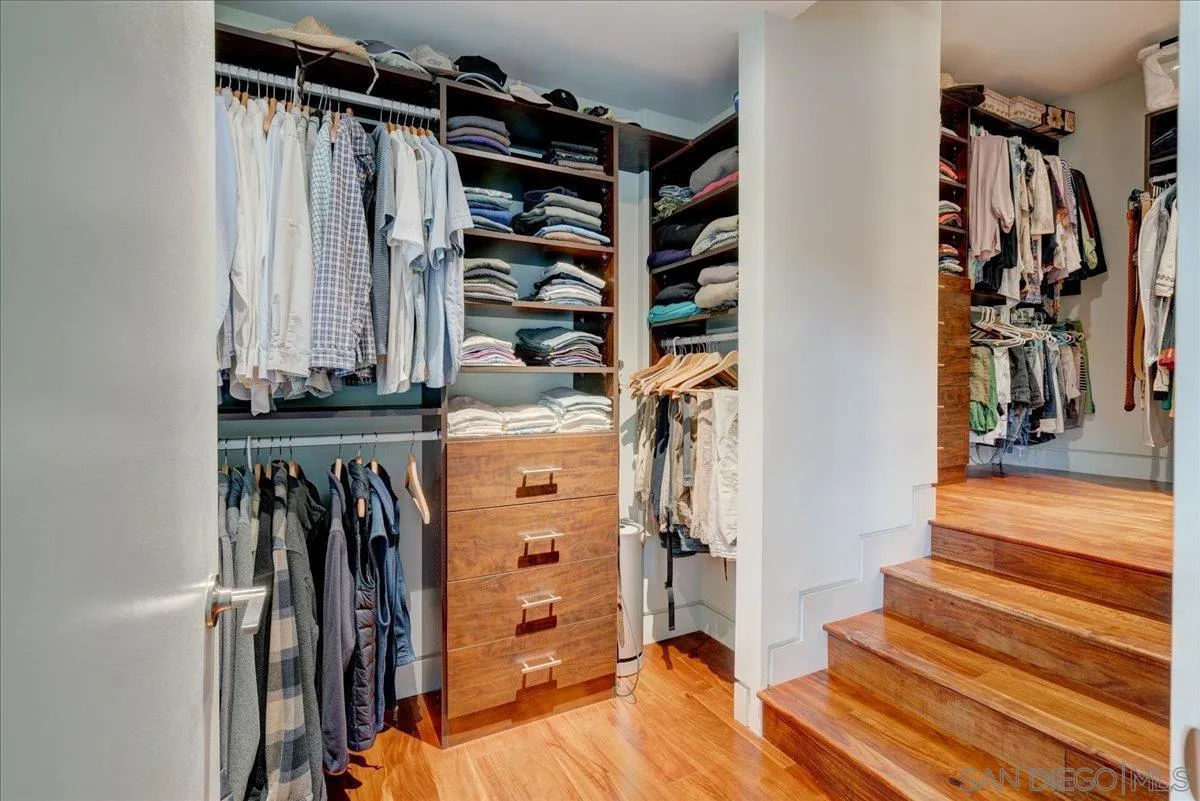 16117 Martincoit Road Poway, CA 92064 - Photo 28 of 50 a view of walk in closet with clothes and shoes