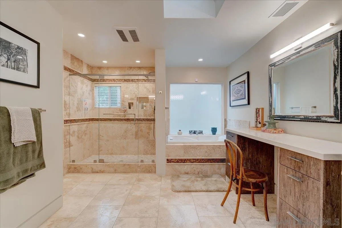 16117 Martincoit Road Poway, CA 92064 - Photo 31 of 50 a large bathroom with a tub sink and mirror