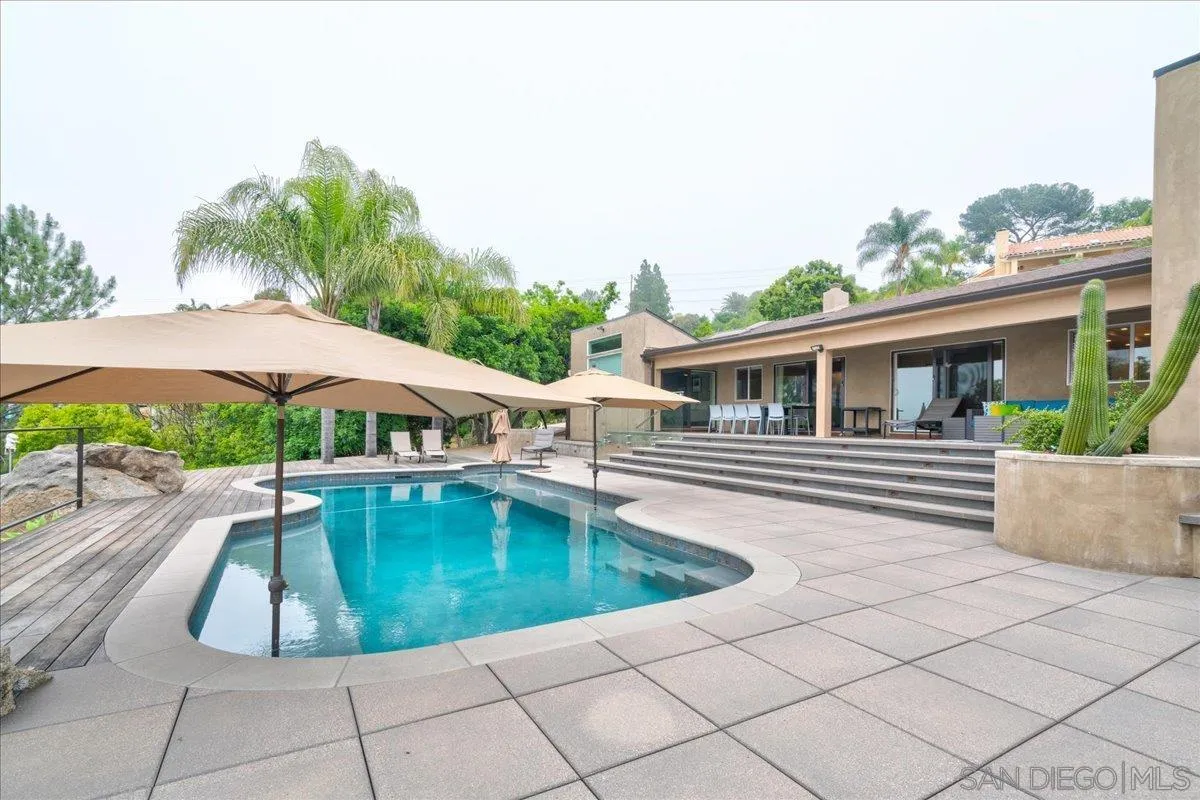 16117 Martincoit Road Poway, CA 92064 - Photo 36 of 50 a view of a house with backyard swimming pool and sitting area