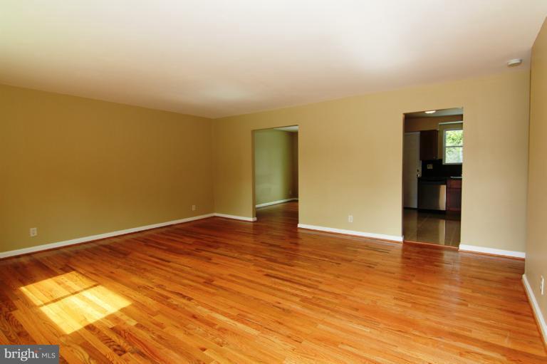 9114 Samoset Road Randallstown, MD 21133 - Photo 11 of 13 a view of empty room with wooden floor