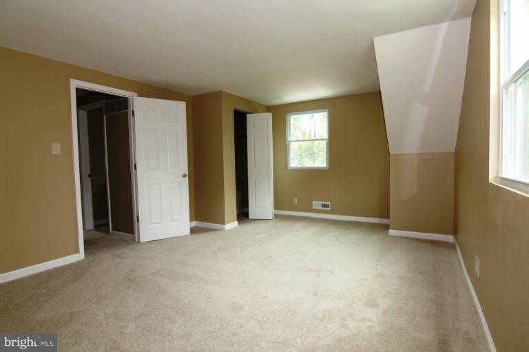 9114 Samoset Road Randallstown, MD 21133 - Photo 4 of 13 an empty room with windows