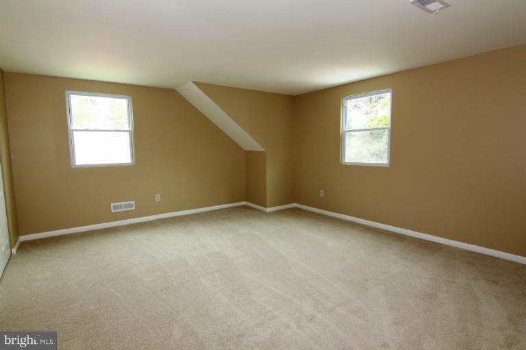 9114 Samoset Road Randallstown, MD 21133 - Photo 9 of 13 an empty room with a window