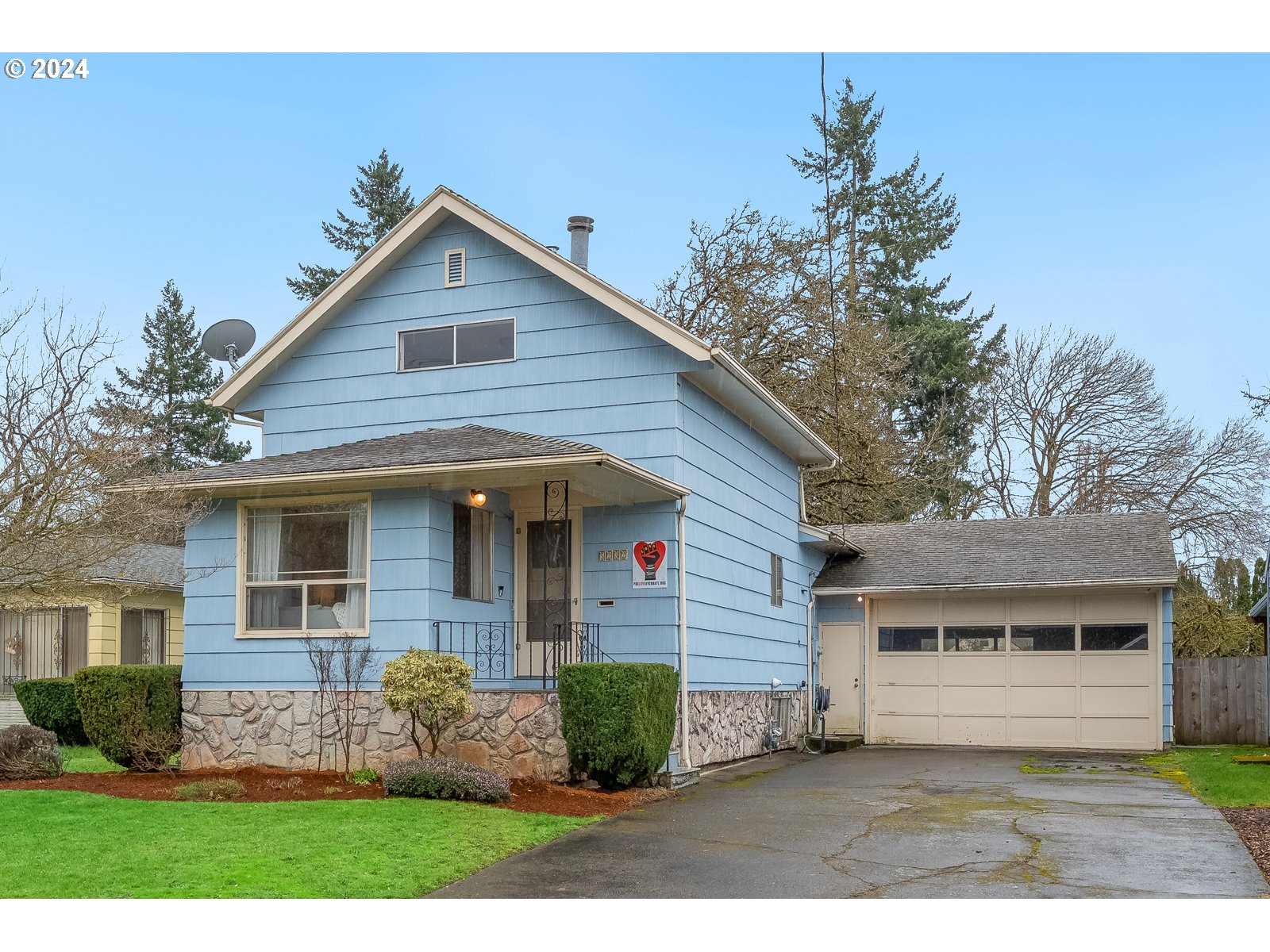 5232 Southeast Raymond Street Portland, OR 97206 - Photo 1 of 39 a front view of a house with garden