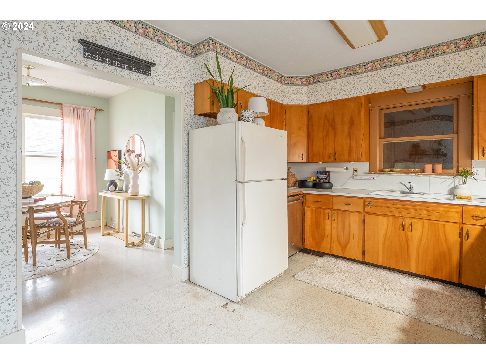 5232 Southeast Raymond Street Portland, OR 97206 - Photo 13 of 39 a kitchen with a refrigerator and a sink