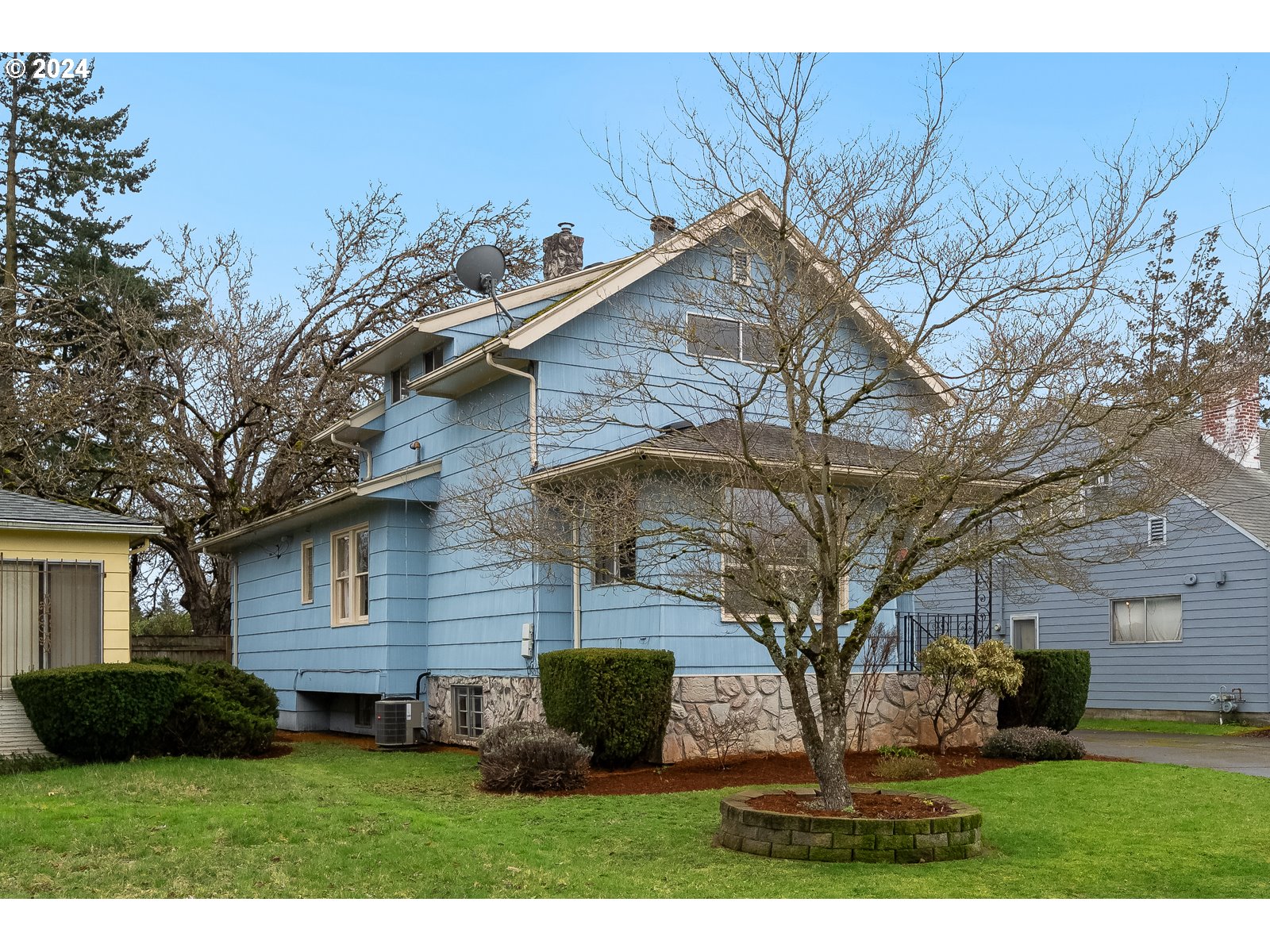 5232 Southeast Raymond Street Portland, OR 97206 - Photo 2 of 39 a view of a backyard with potted plants and large tree