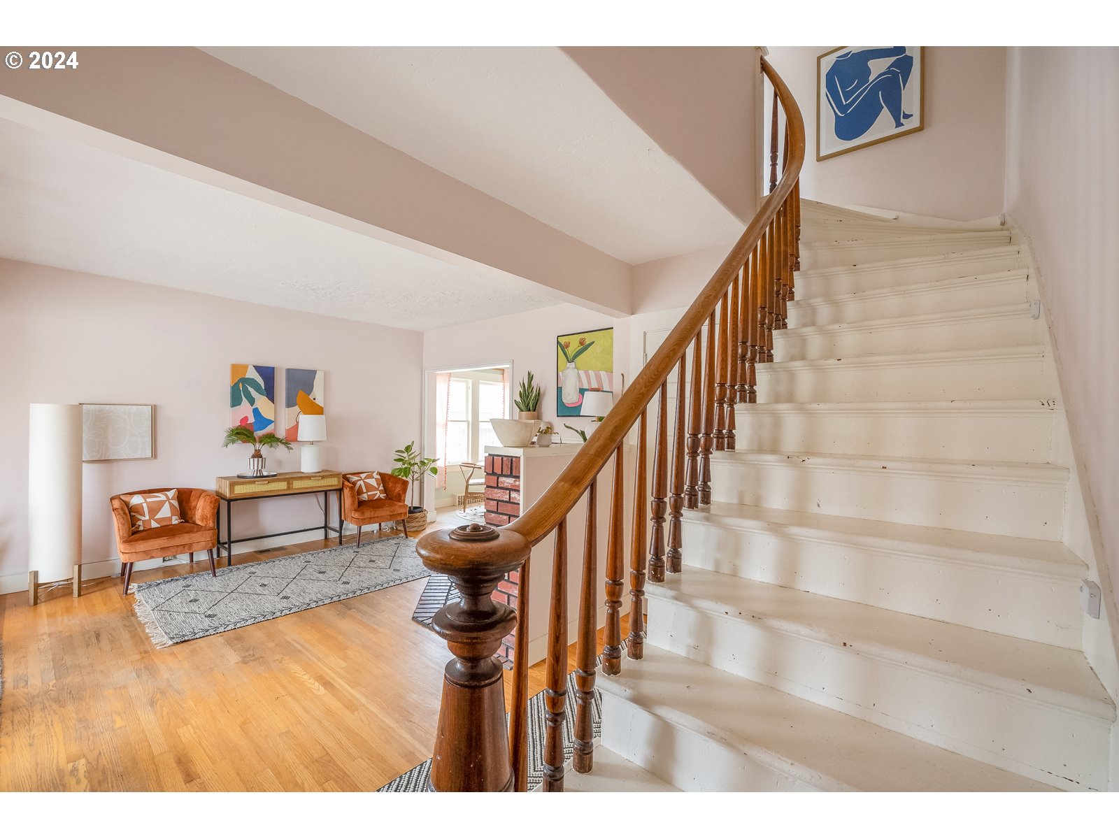 5232 Southeast Raymond Street Portland, OR 97206 - Photo 21 of 39 a living room with furniture and a table with wooden floor