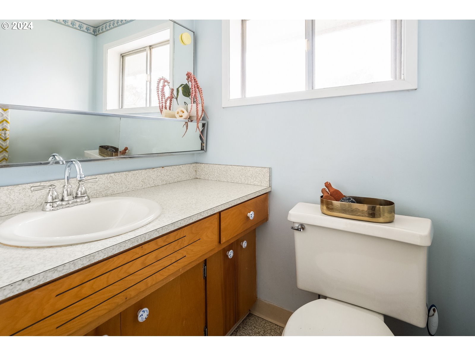 5232 Southeast Raymond Street Portland, OR 97206 - Photo 25 of 39 a bathroom with a sink and a toilet