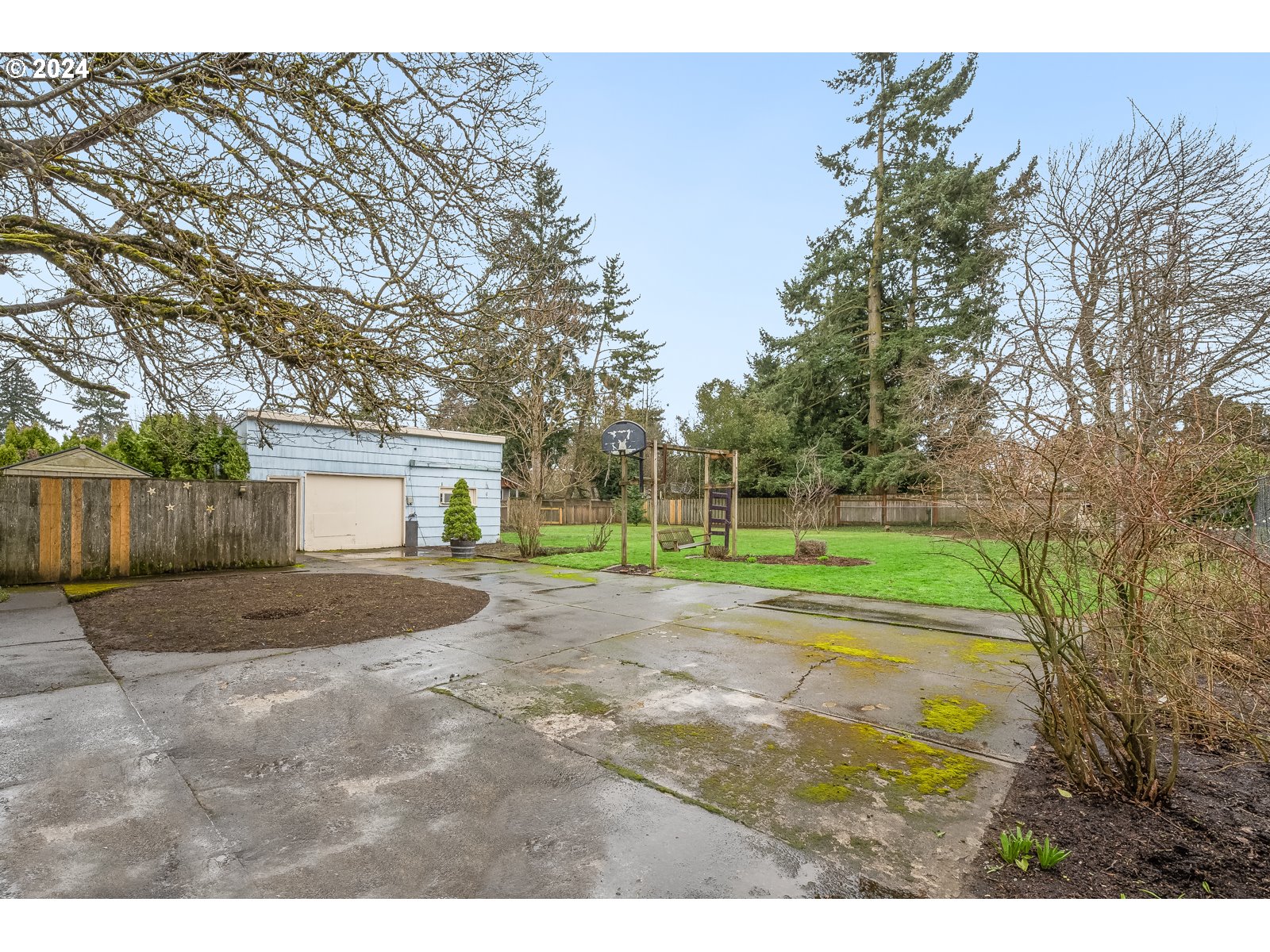 5232 Southeast Raymond Street Portland, OR 97206 - Photo 34 of 39 a view of a house with a backyard and a tree