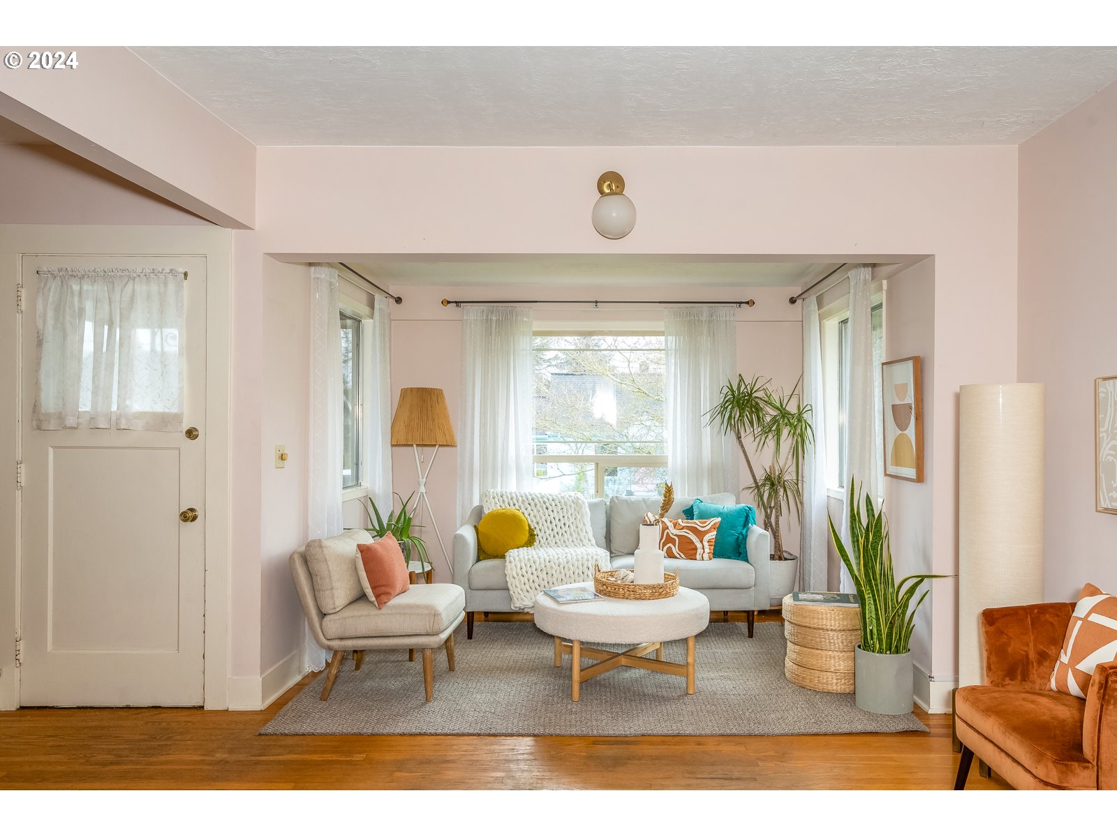 5232 Southeast Raymond Street Portland, OR 97206 - Photo 5 of 39 a living room with furniture and a large window