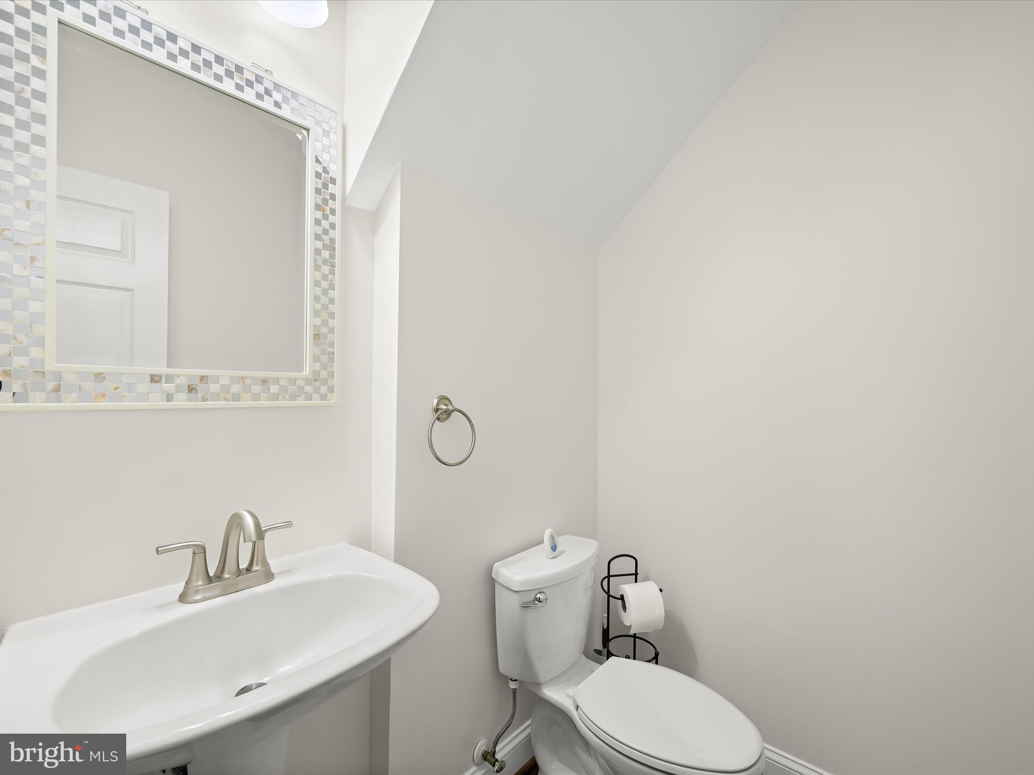 2711 Middle Neck Road Odenton, MD 21113 - Photo 15 of 42 a bathroom with a sink mirror and toilet
