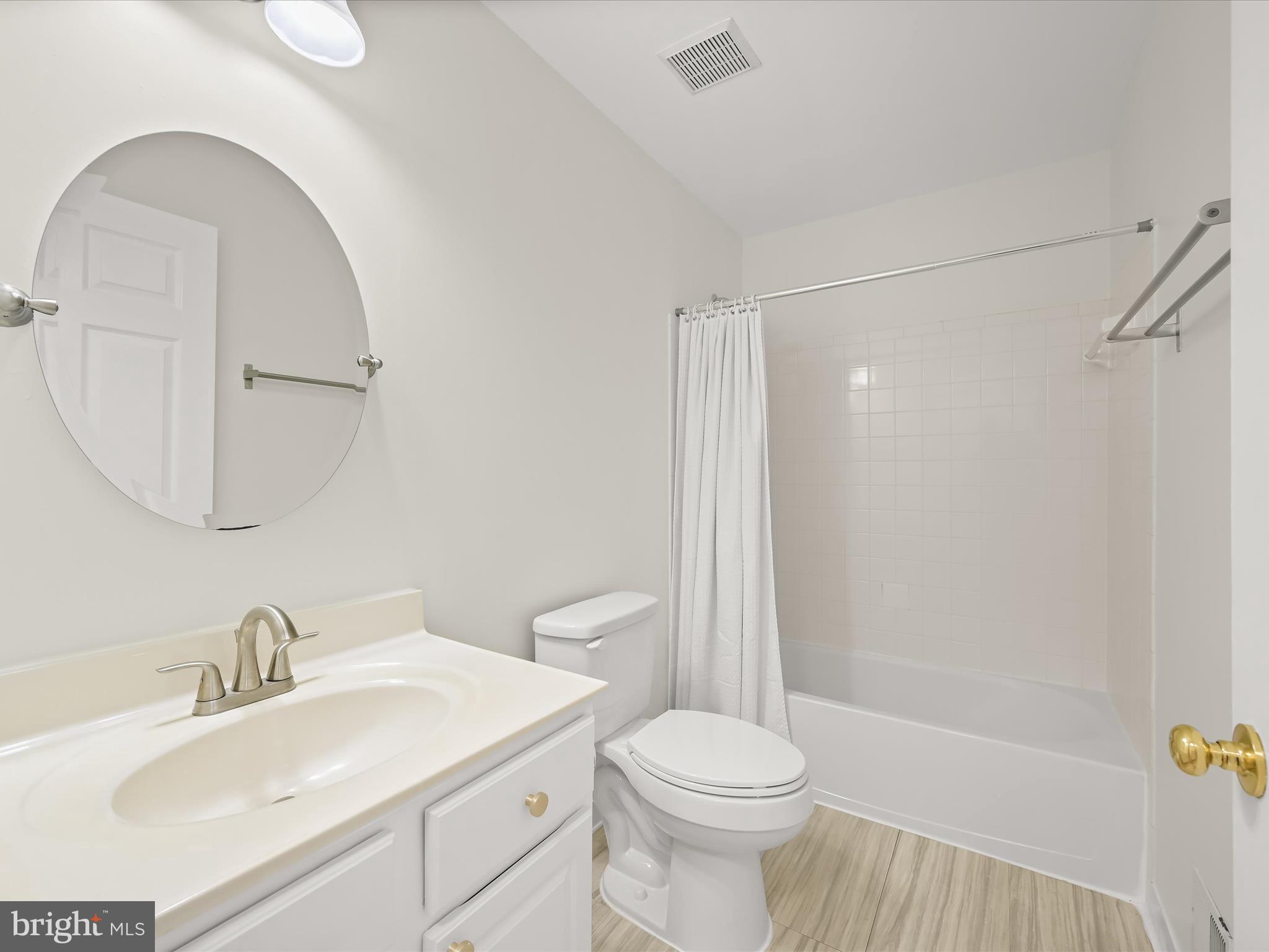 2711 Middle Neck Road Odenton, MD 21113 - Photo 21 of 42 a bathroom with a sink toilet and shower