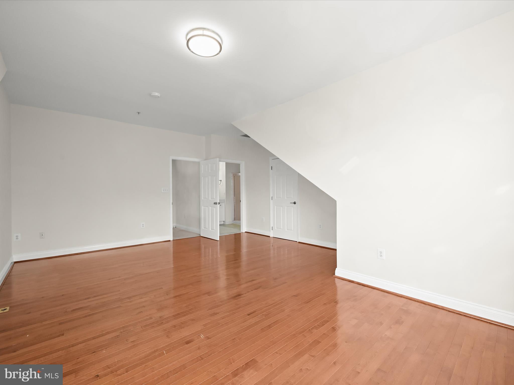 2711 Middle Neck Road Odenton, MD 21113 - Photo 24 of 42 a view of an empty room with wooden floor