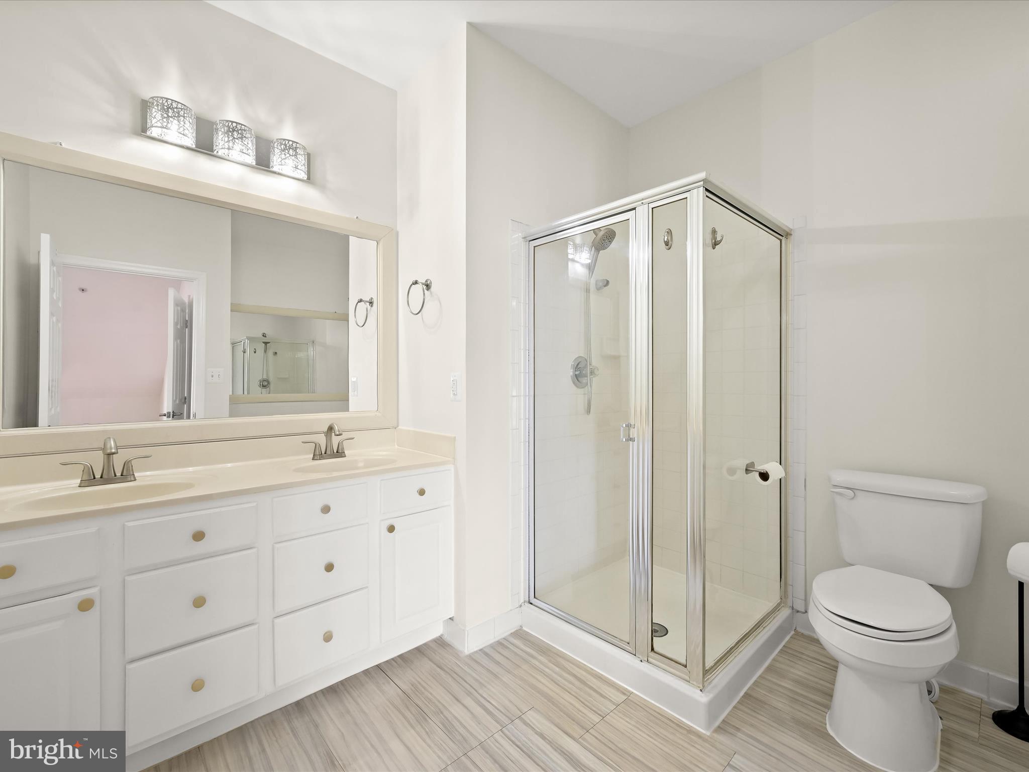 2711 Middle Neck Road Odenton, MD 21113 - Photo 25 of 42 a bathroom with a granite countertop sink toilet and shower