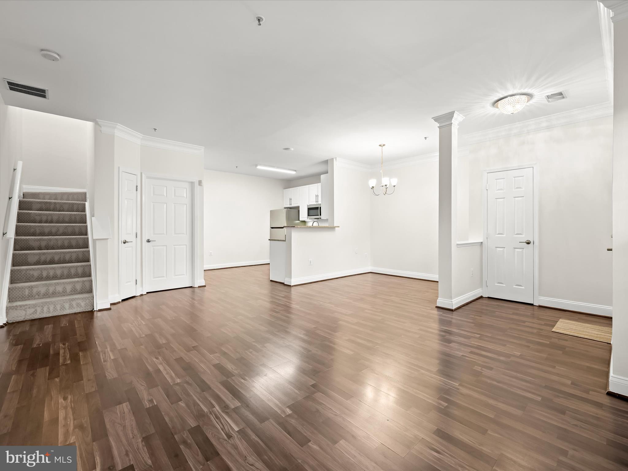 2711 Middle Neck Road Odenton, MD 21113 - Photo 5 of 42 an empty room with wooden floor and windows