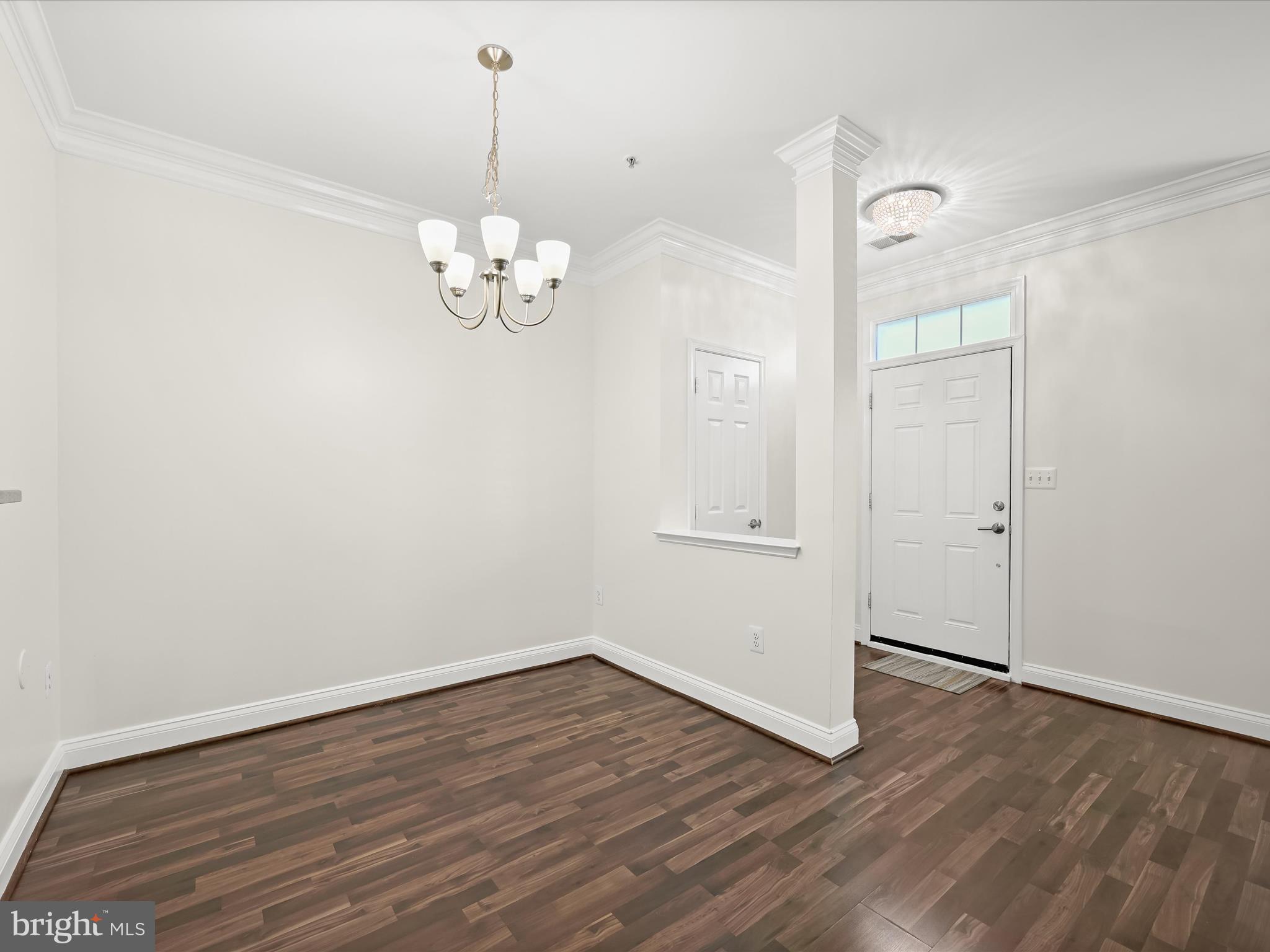 2711 Middle Neck Road Odenton, MD 21113 - Photo 6 of 42 an empty room with wooden floor and windows