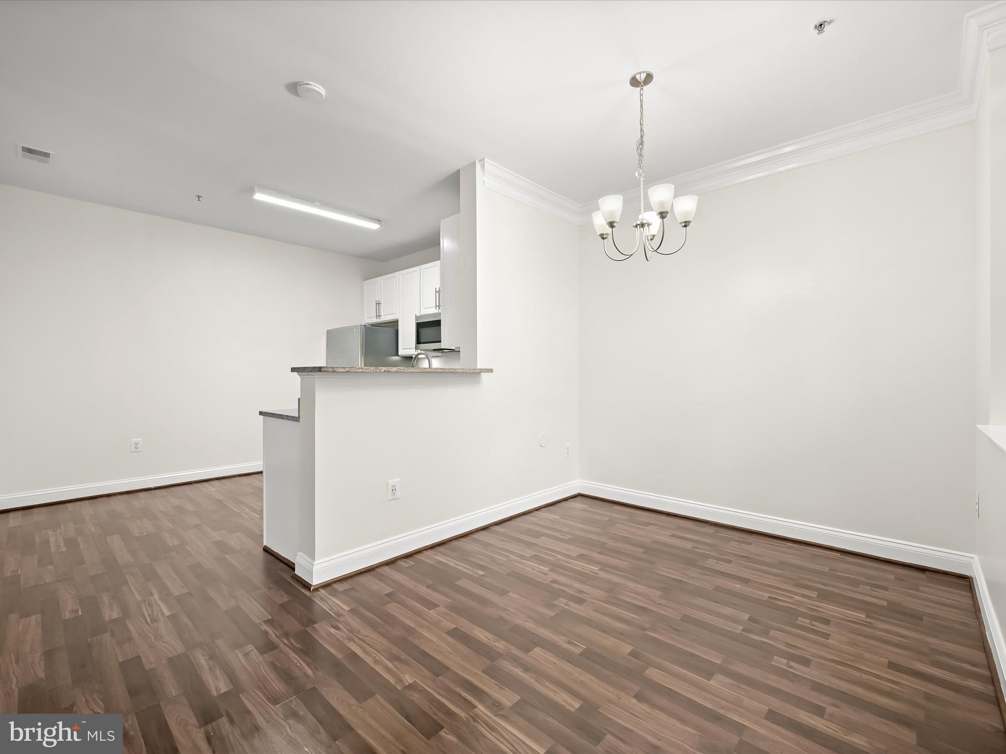 2711 Middle Neck Road Odenton, MD 21113 - Photo 8 of 42 wooden floor in an empty room with a window