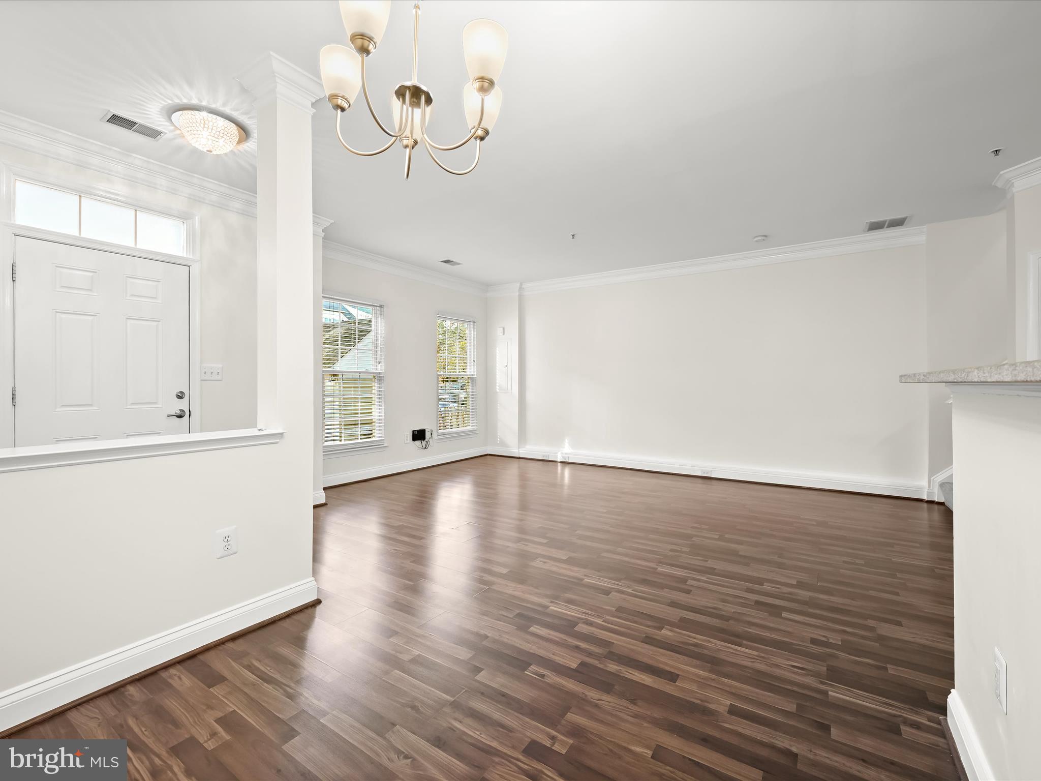 2711 Middle Neck Road Odenton, MD 21113 - Photo 9 of 42 a view of a room with wooden floor and white walls
