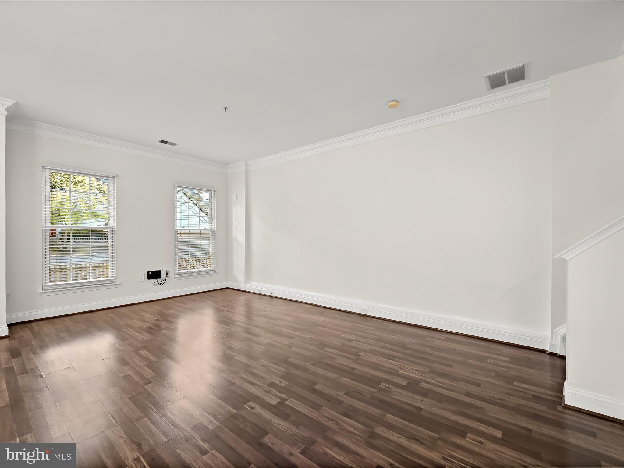 2711 Middle Neck Road Odenton, MD 21113 - Photo 10 of 42 a view of an empty room with wooden floor and a window