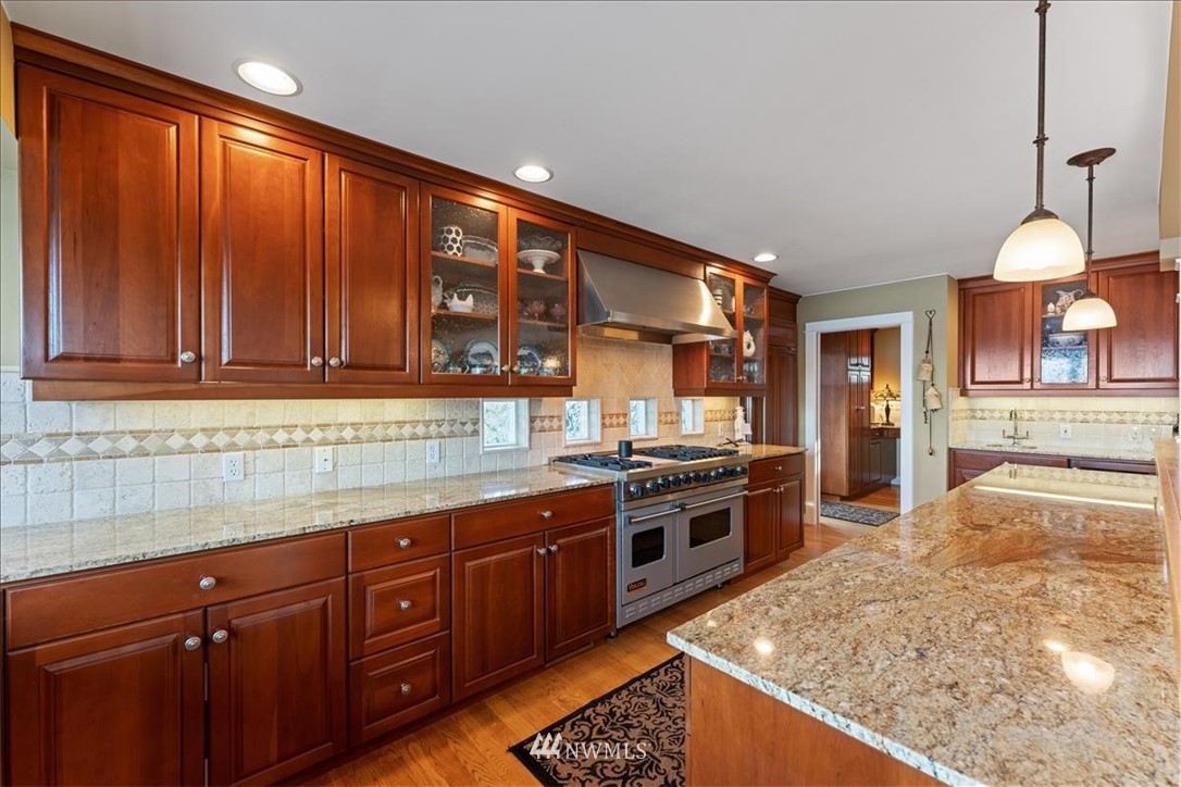 1707 Vernon Road Lake Stevens, WA 98258 - Photo 11 of 40 a kitchen with stainless steel appliances granite countertop wooden cabinets a stove and a sink