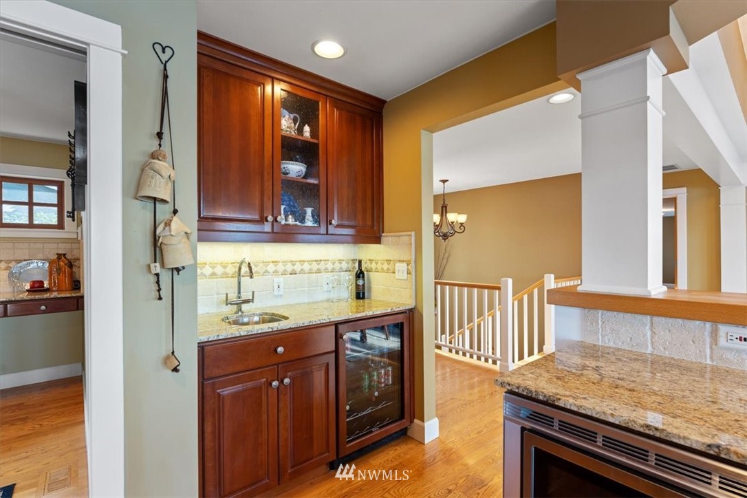 1707 Vernon Road Lake Stevens, WA 98258 - Photo 13 of 40 a kitchen with a stove and a wooden cabinets