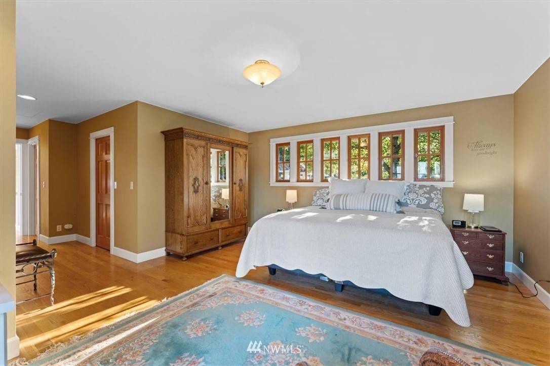 1707 Vernon Road Lake Stevens, WA 98258 - Photo 19 of 40 a bedroom with a bed and wooden floor