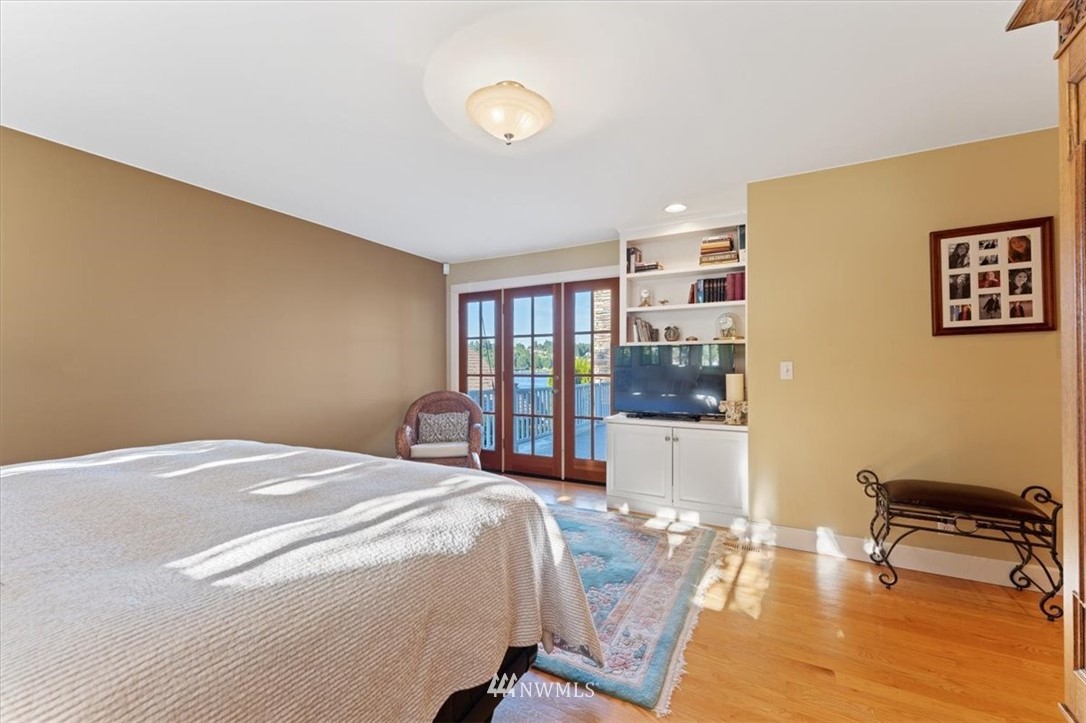 1707 Vernon Road Lake Stevens, WA 98258 - Photo 20 of 40 a bedroom with a bed and wooden floor